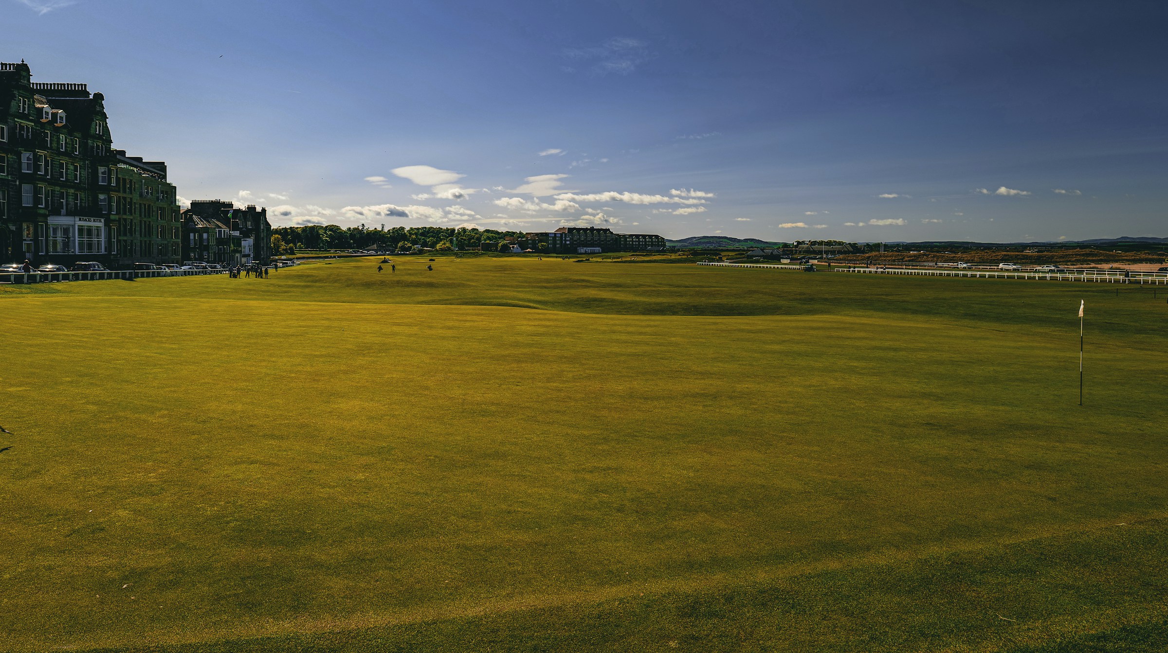 A wide fairway and clubhouse at the Old Course, St Andrews, Scotland